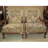 A pair of open armchairs, the showwood frames with well carved acanthus, gadroon and other detail,