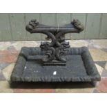 A cast iron boot scraper with foliate detail and rectangular tray base, 38 cm wide x 30 cm deep x 26