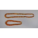Two graduated amber bead necklaces, each with 9ct clasp (2)