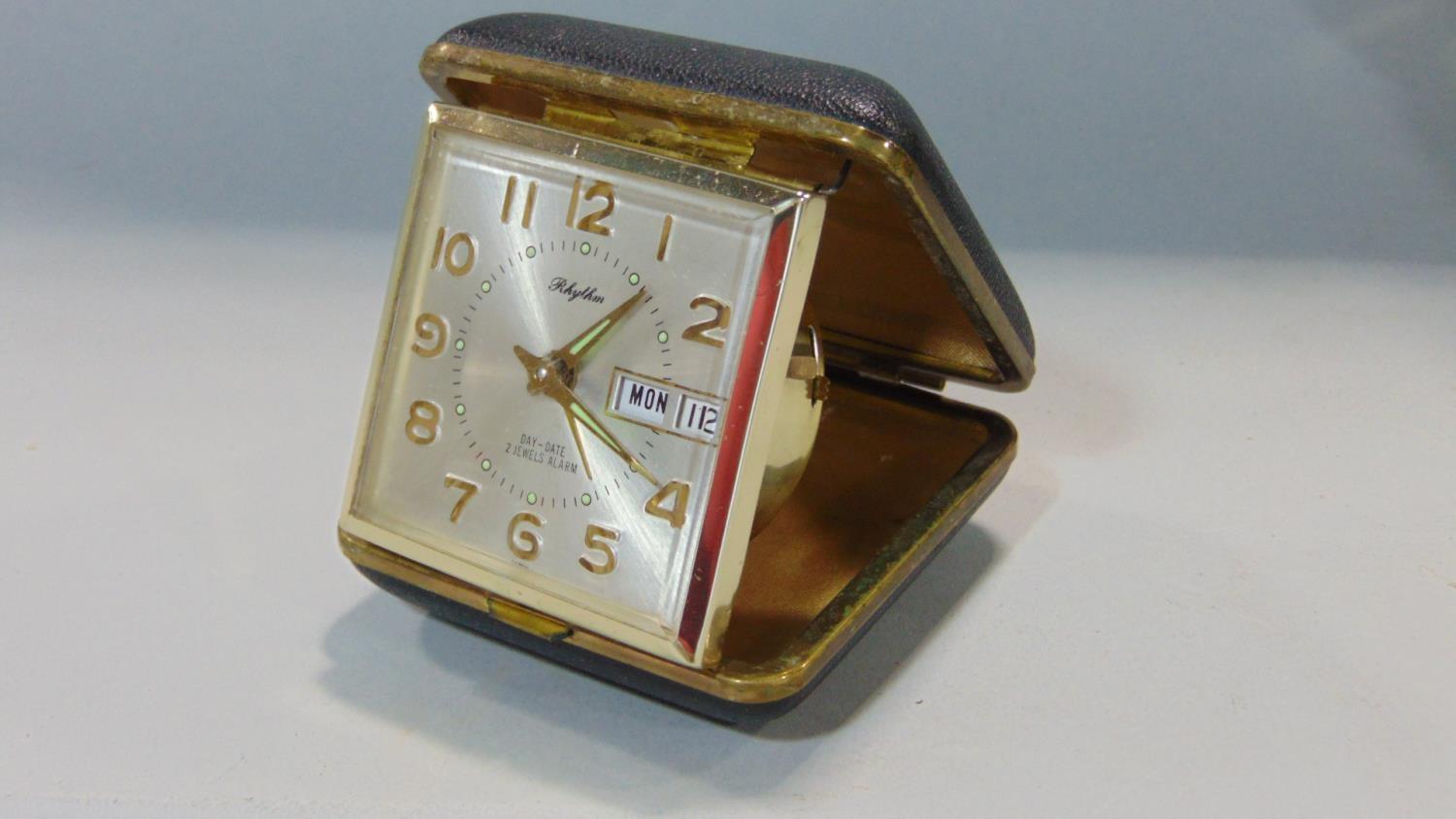 A collection of eleven various leather cased folding travel alarm clocks by HAC, Westclox and others - Image 3 of 3