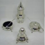 A set of three silver condiments in a Georgian style, cauldron salt, pepper and mustard pot, with