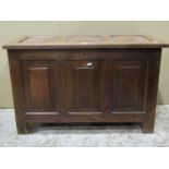 A panelled oak coffer with hinged lid, 92 cm wide x 41 cm deep x 58 cm in height