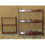 A flight of 19th century mahogany bow fronted wall shelves with pierced and moulded gothic tracery