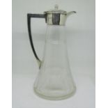 A cut glass claret decanter, the trumpet shaped body with faceted and reeded cut detail, with silver
