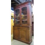 A Victorian mahogany chiffonier bookcase, the upper section with moulded cornice over a pair of