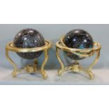 A pair of contemporary celestial and terrestrial globes, raised on brass frameworks, 30cm diameter