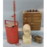 A vintage oak stationery box with six drawers, a pulley block, a vintage stirrup pump and an art