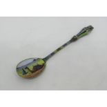 A good quality Egyptian silver enamelled souvenir spoon, the bowl decorated with kneeling man and