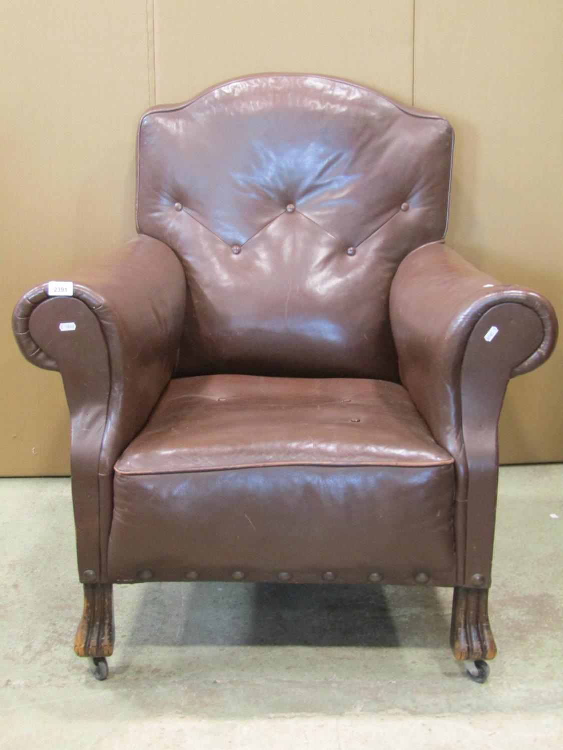 An early 20th century easy chair in the traditional style with rolled arms and shaped back, faux - Image 2 of 2
