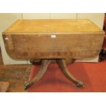 An early 19th century mahogany Pembroke breakfast table, with drop leaves, one frieze drawer, raised