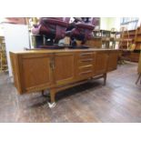 G-Plan Fresco teak sideboard, fitted with four short drawers, flanked by two pairs of cupboard