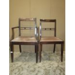 A set of four (2&2) mahogany bar back dining chairs in the Regency style with drop in upholstered