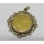 Sovereign dated 1873, in 9ct openwork pendant mount, 11.8g