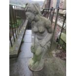 A weathered cast composition stone garden figure of a classically draped maiden, 104 cm in height