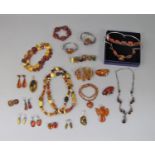 Varied collection of stylised amber jewellery, most pieces silver mounted, some hallmarked