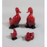 A pair of Royal Doulton Flambe models of ducks with impressed mark to base of one, number 137,