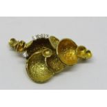 Abstract yellow metal brooch with textured finish, set with four diamonds, 4.5cm wide approx, 12g