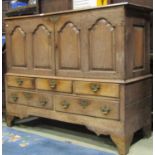 A Georgian oak two sectional mule chest later converted to a side cupboard, enclosed by fielded