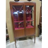 An inlaid Edwardian mahogany side cabinet with boxwood stringing, enclosed by a pair of