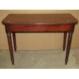 A early 19th century mahogany side table raised on ring turned and tapered supports