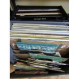 Two cases containing a mixed collection of vinyl LPs and 45rpm singles - classical, jazz, pop,