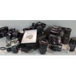 A collection of photographic equipment including a Pentax SLR digital camera, K100d, with Tamron