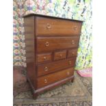 Stag Minstrel Tallboy, fitted with an arrangement of seven drawers upon bracket feet, 113cm high x