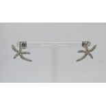Pair of 18ct white gold diamond set earrings in the form of starfish, 4.3g total