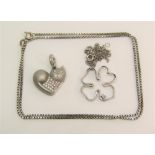 Group of white gold jewellery comprising a heart shaped pendant in the form of a cat, a four leaf