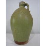 Good studio pottery celadon glaze jug, marked with a M, 32cm high