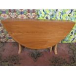 Ercol light elm drop leaf dining table on tapered bracket supports, 72cm high x 140cm extended