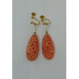 Pair of 9ct coral drop earrings with carved floral decoration, coral 2.8cm long approx
