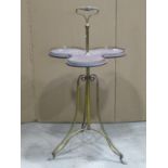An Edwardian brass and mahogany trefoil shaped cake stand with pierced brass gallery, central handle