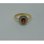 18ct garnet and diamond oval cluster ring, size O, 3.3g