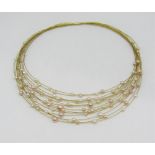 18ct multi strand collar necklace interspersed with cultured pearls, 27.5g