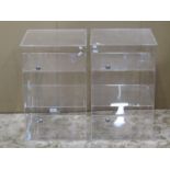 A pair of perspex counter top display cabinets, each enclosed by a single full length door, 38 cm