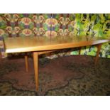 1970s teak coffee table with unusual shaped top upon tapered legs, 121cm long x 40cm high