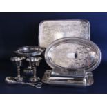 A small collection of silver plated wares including a rectangular tray, an oval tray, comport,