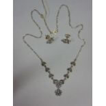 Silver seed pearl and marcasite pendant necklace of floral design and a matched pair of stud