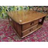 Ercol 'Pandora's Box' Golden Dawn coffee table, upon original castors, 41cm high x 80cm wide