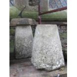 A pair of weathered hollow cast composition stone staddlestone type bases of tapered form, one