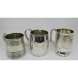 Three small silver tankards, two Georgian and one Victorian, 9oz approx