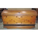 An 18th century oak domed topped trunk with exposed dovetail and pegged construction, inlaid