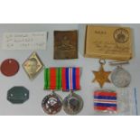 Two 39/45 war medals, Defence medal, 39-45 Star and a small quantity of packing, etc