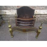 A Georgian design steel and brass fire basket with serpentine front, pierced grill, urn finials