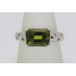 Green gem and diamond ring, unmarked tests at 18ct white gold, size N, 7.1g