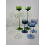 A collection of Wedgwood Kings Lynn candle holders to include a pair of tall green glass examples,
