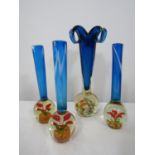 Set of three Murano type paperweight vases, with mottled blue stems over an inset floral spherical