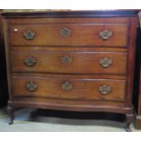 A Georgian mahogany bedroom chest, the serpentine front fitted with three inverted graduated drawers