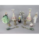 A Lladro figure group of a pair of young lovers, a further Lladro figure of a hooded child, a